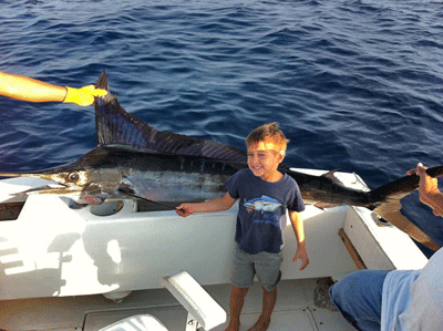 emilio-valdez-with-his-first-striped-marlin-at-5-years-old.gif